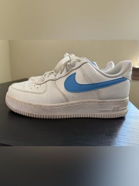 Nike White Low-Top Sneaker with Sky Blue Swoosh